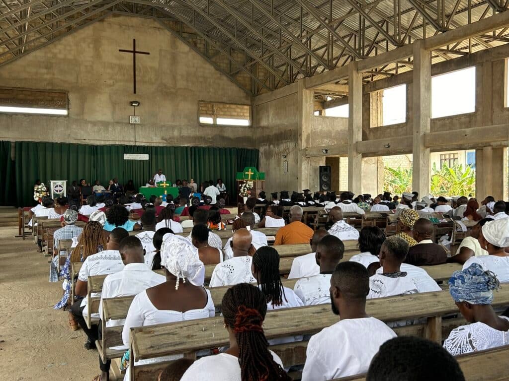 Community gathering in Ghana-inspired setting
